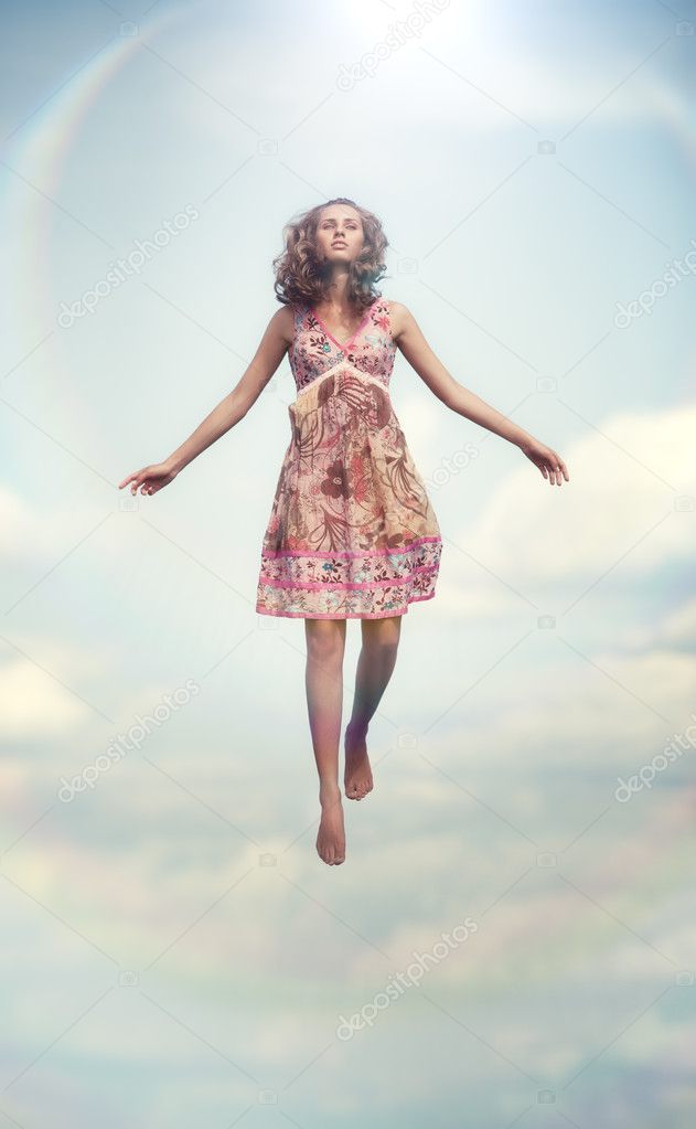 Young woman flying up