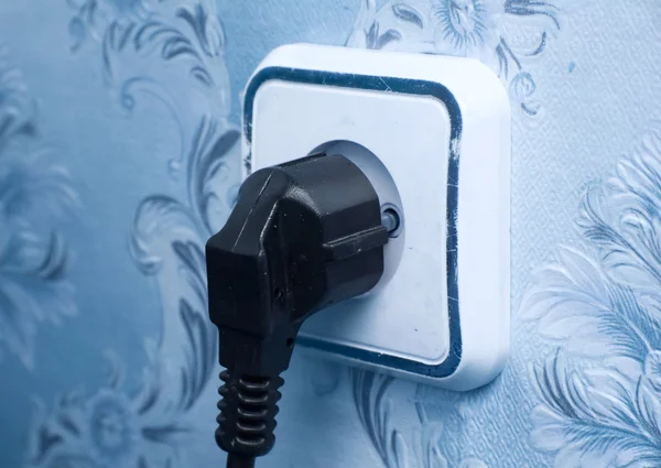Twee-pin plug in een socket — Stockfoto