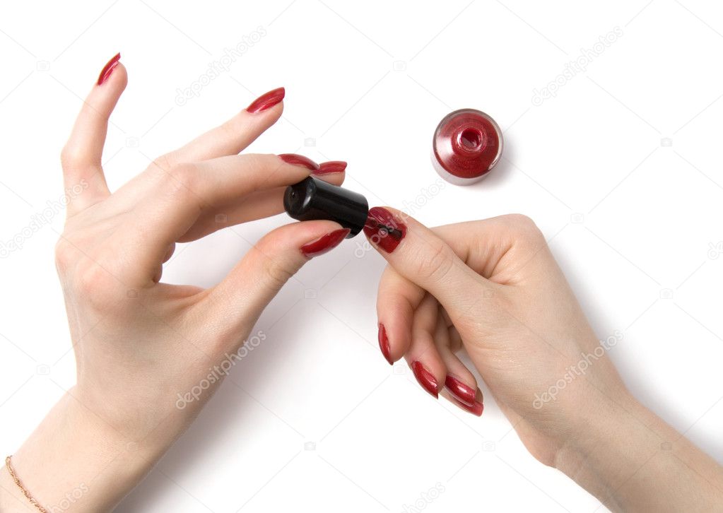 Woman color her red nails