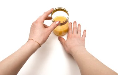 Woman holding glass of juice clipart