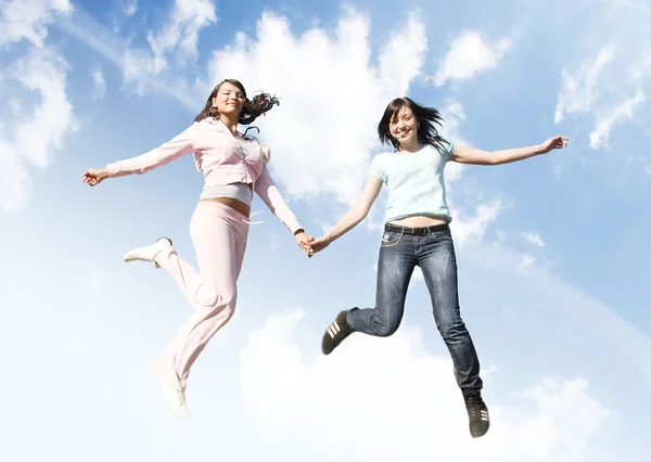 Jumping joyful girls — Stock Photo, Image