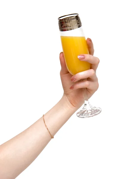 Suco de laranja e mão de mulher — Fotografia de Stock