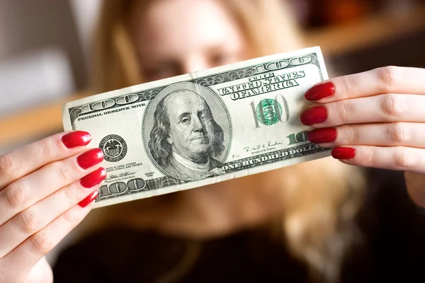 Dollar in front of face — Stock Photo, Image