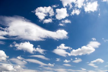 High contrast blue sky with clouds clipart