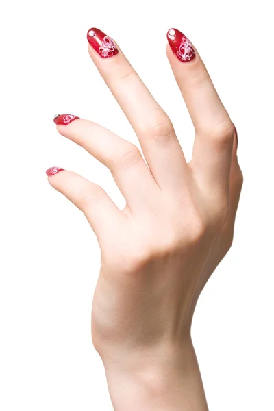 Женская рука с украшенными ногтями — стоковое фото