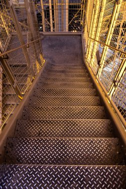 Metallic stairs on a factory clipart