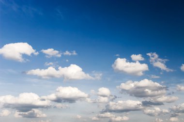 High contrast blue sky with clouds clipart