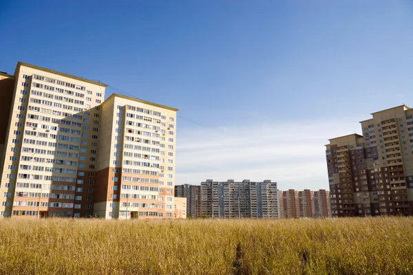 Modern buildings in a field — Stock Photo, Image