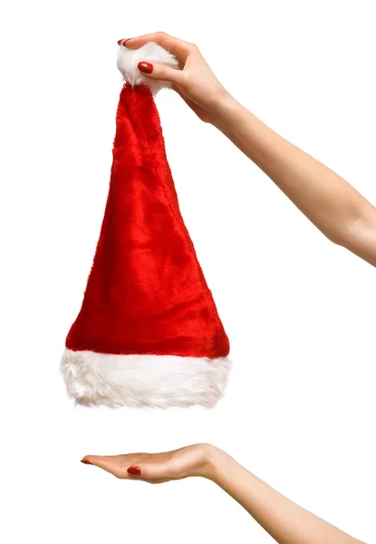 Woman hands lifting up santa hat — 스톡 사진