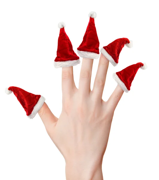 Frauenhand mit Weihnachtsmützen — Stockfoto