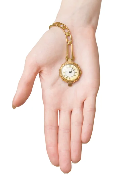Женская рука с золотыми часами — стоковое фото