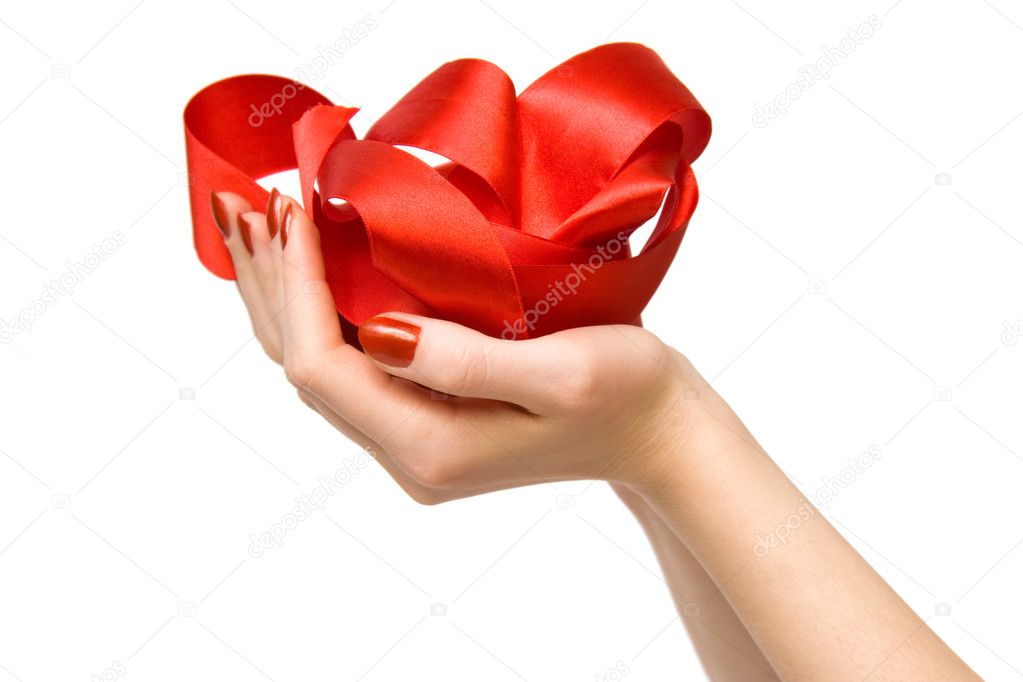 Woman hand holding red ribbon