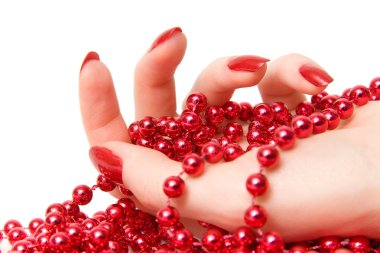 Woman hand with red glassbeads closeup clipart