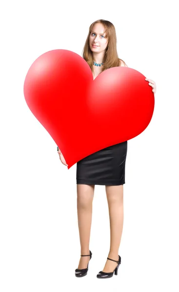 Young woman holding big heart shape — Stock Photo, Image