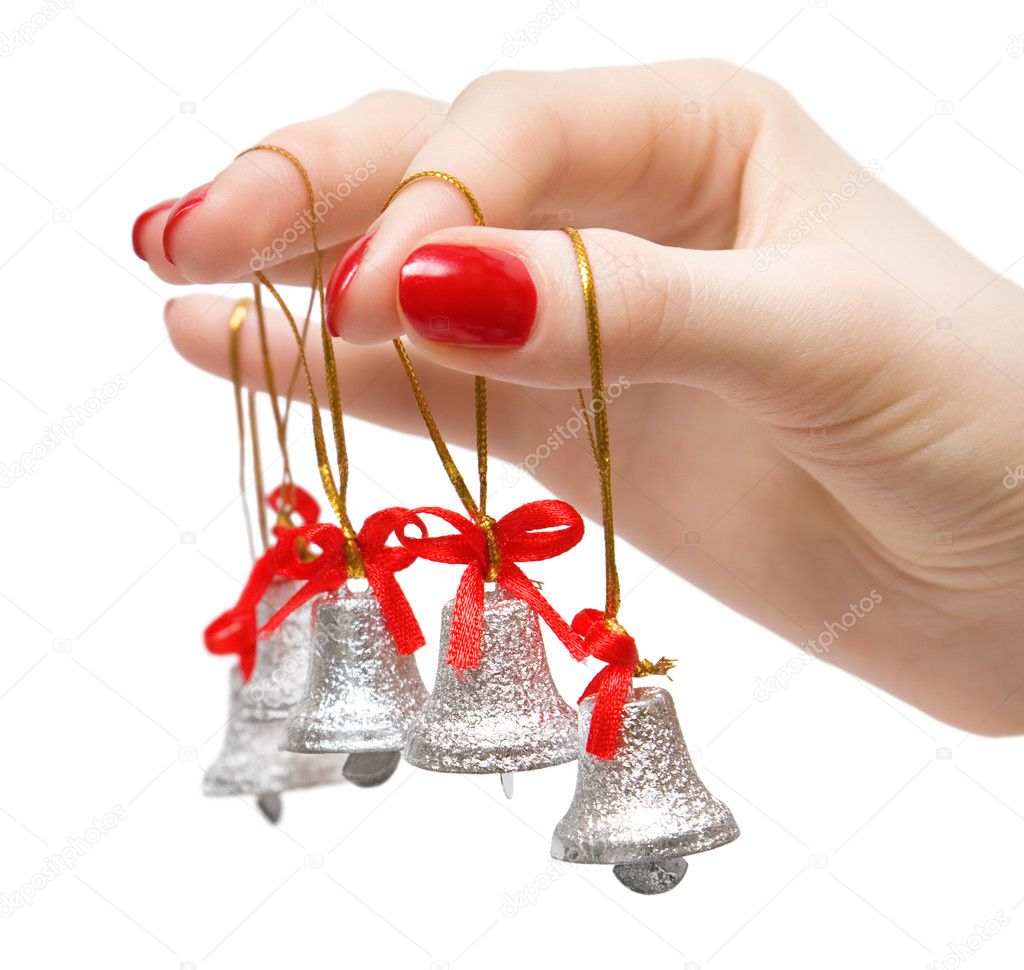 Woman hand with small bells on fingers