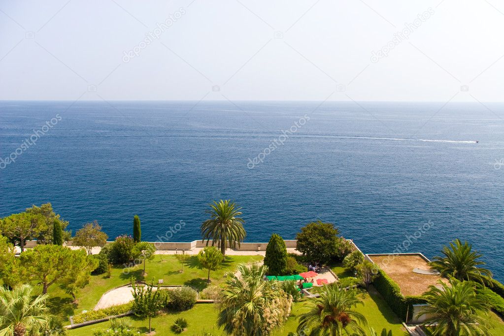 View on a sea and green garden