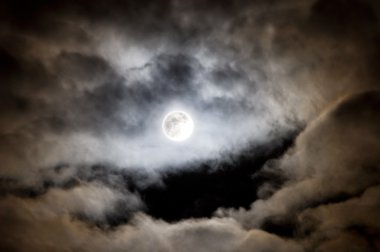 Bright full moon and clouds clipart