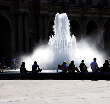 Fountain and resting silhouettes clipart