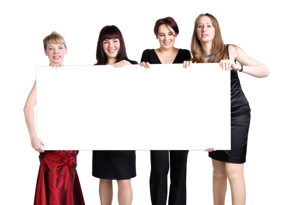 चार महिलाओं रिक्त सफेद पोस्टर पकड़े हुए — स्टॉक फ़ोटो, इमेज