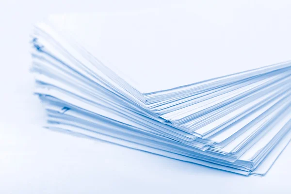 Heap of paper blue tint — Stock Photo, Image