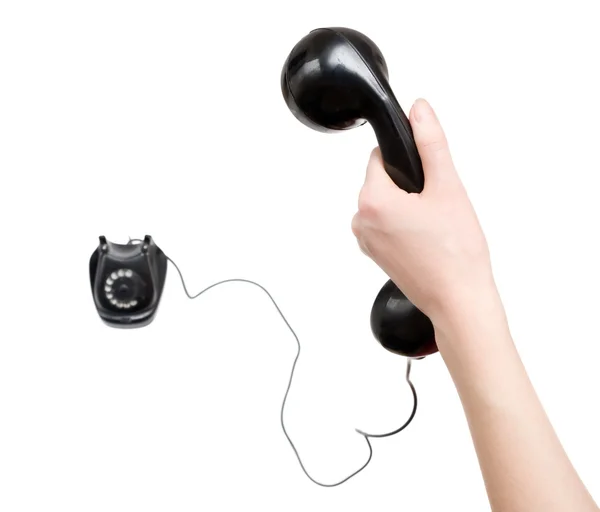 Vrouw hand met zwarte retro telefoon — Stockfoto