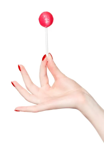 Woman hand with lollipop — Stock Photo, Image