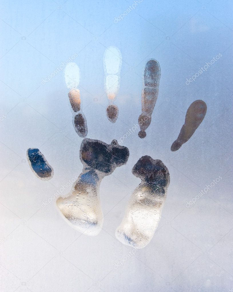 Hand print on frozen glass