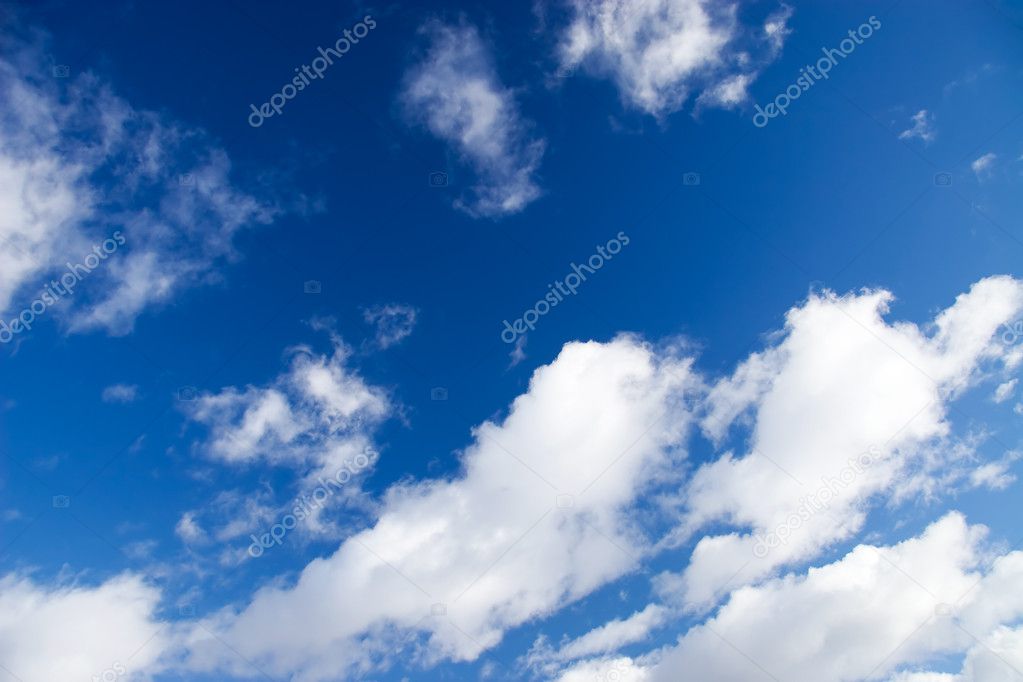 Blue sky with fluffy clouds