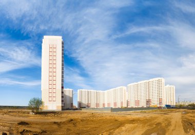 New buildings on blue sky background clipart