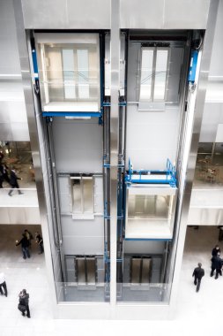 Modern elevator in business center clipart