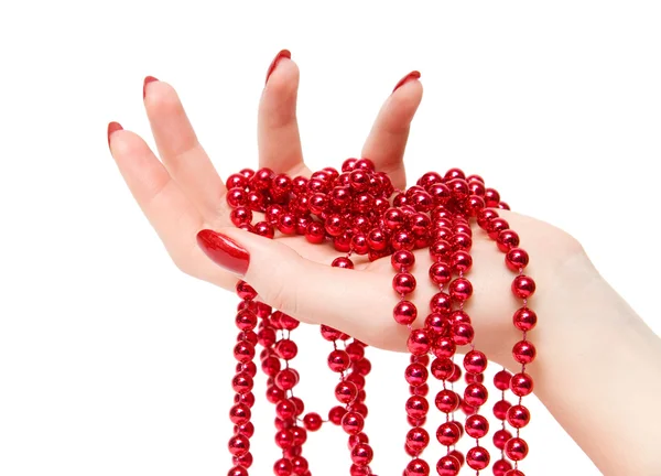 Mulher mão com contas de vidro vermelho close-up — Fotografia de Stock