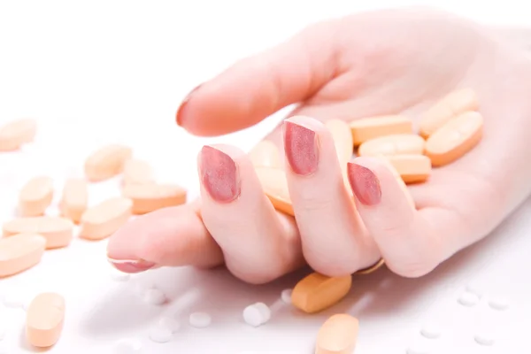 Femme main avec beaucoup de pilules — Photo