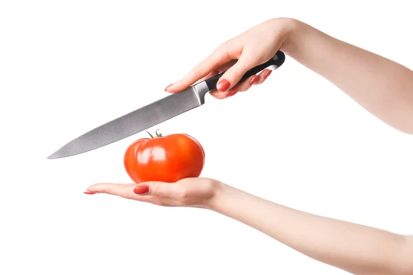 Nő kezébe kést parketta paradicsommal — Stock Fotó