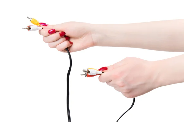 Dwie ręce kobieta trzyma audio kabel piny — Zdjęcie stockowe
