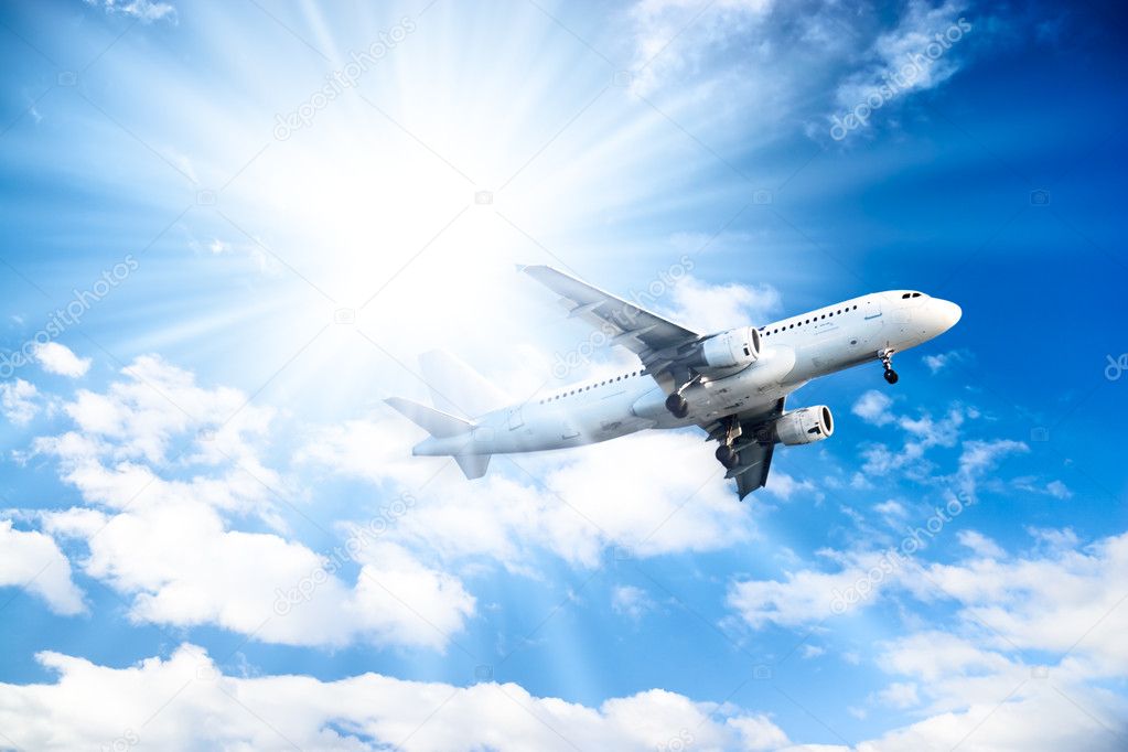 Airplane on blue sky background Stock Photo by ©chaoss 1751903