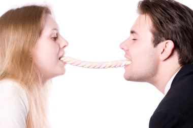 Man and woman eating one long sweets clipart