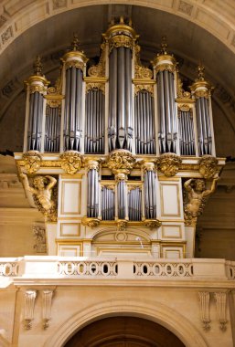 Old music organ in cathedral clipart