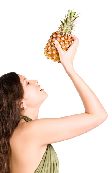 Young woman holding pineapple — Stock Photo, Image