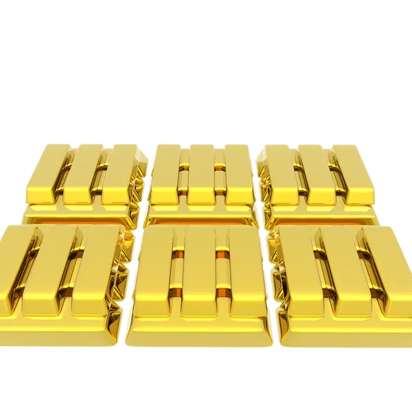 Staplade barer av guldtackor på en vit — Stockfoto