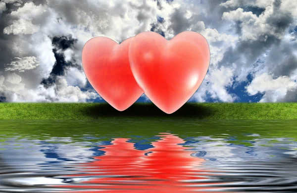 Red hearts on the grass — Stock Photo, Image