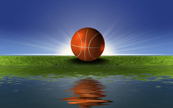 Баскетбольный мяч на зеленой траве — стоковое фото