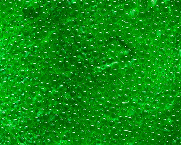 Green metal with water droplets — Stock Photo, Image