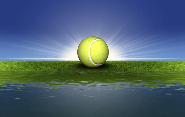 Теннисный мяч на зеленой траве — стоковое фото