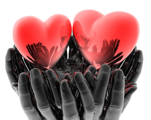 Ярко-красные стеклянные сердца в руках — стоковое фото