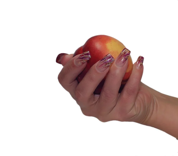 Frauen Hand hält Pfirsich isoliert auf einem weißen — Stockfoto
