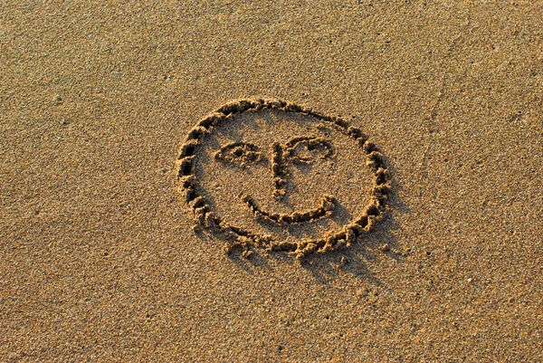 Smile drawn on the sand — Stock Photo, Image