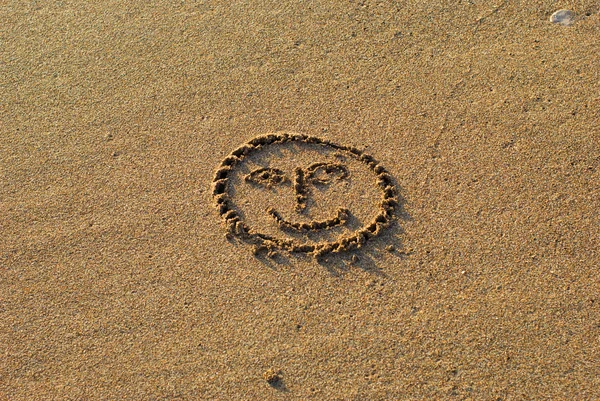 Smile drawn on the sand — Stock Photo, Image