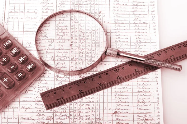 Closeup of a chart with a magnifying glass — Stock Photo, Image