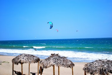 Kiteboarding on Pacific coast clipart