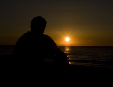 The lonely man looks beautiful sunset clipart